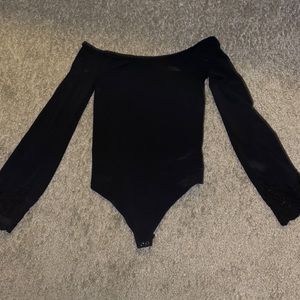 Lightly worn black body suit
